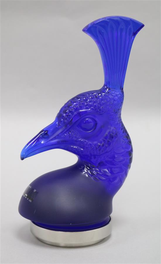 A Lalique cobalt blue glass Tete de Paon car mascot, modelled as a Peacocks head, on circular stand, etched Lalique, boxed